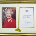 A bespoke picture framing from Nuneaton picture framers ltd designed to celebrate a royal anniversary or birthday congratulatory letter alongside the card.